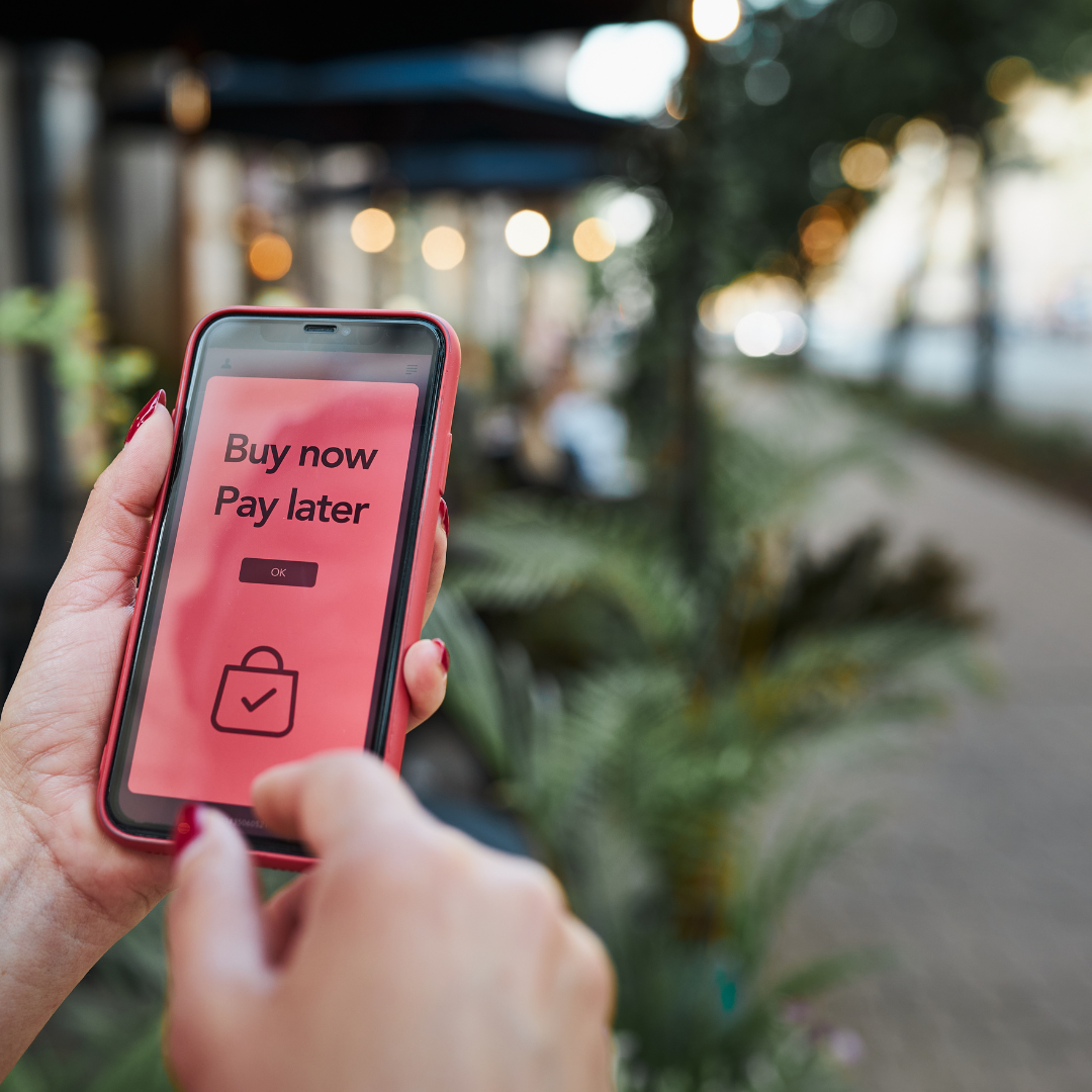 Consumer using a smartphone to select a Buy Now Pay Later option