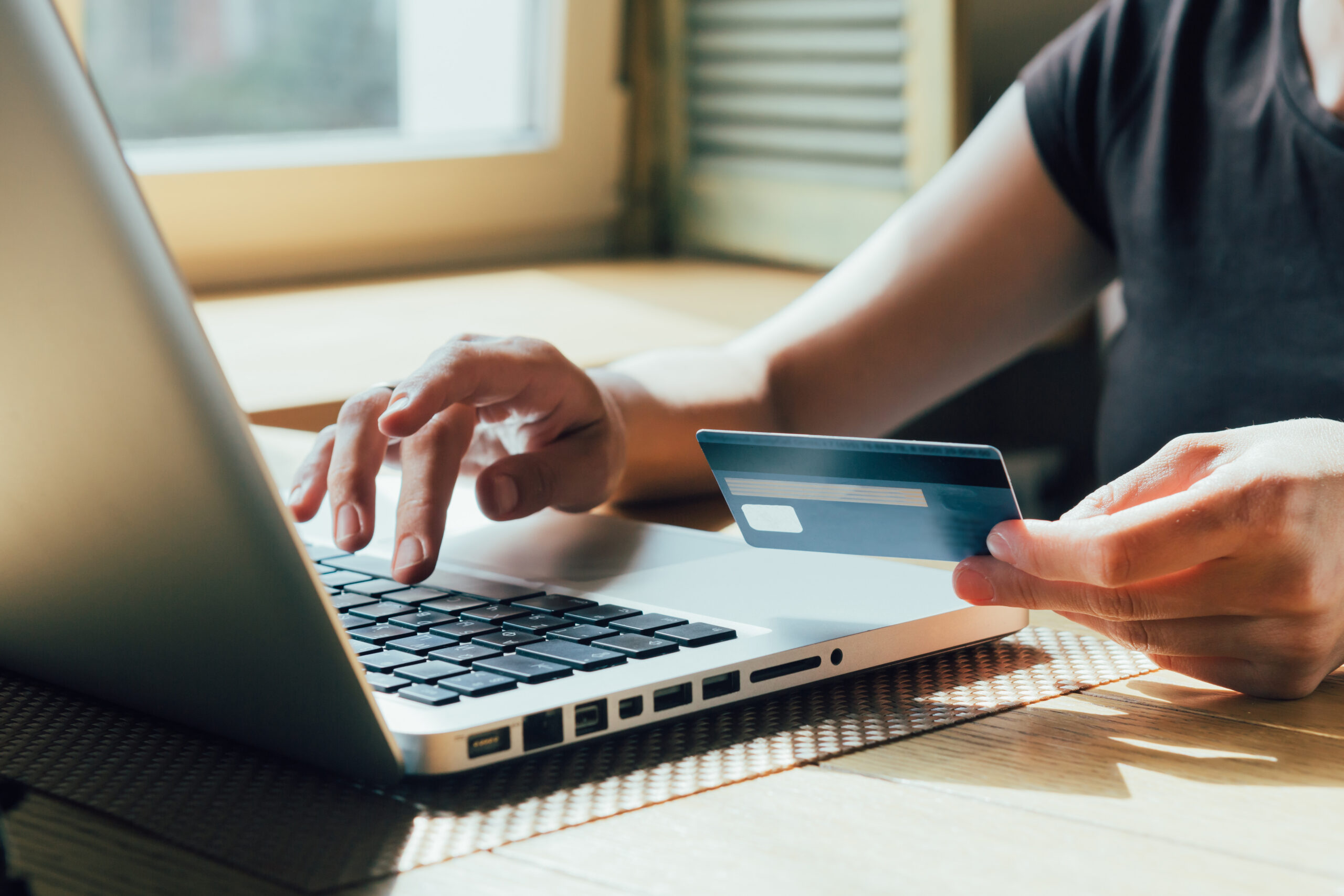 using a credit card at a computer