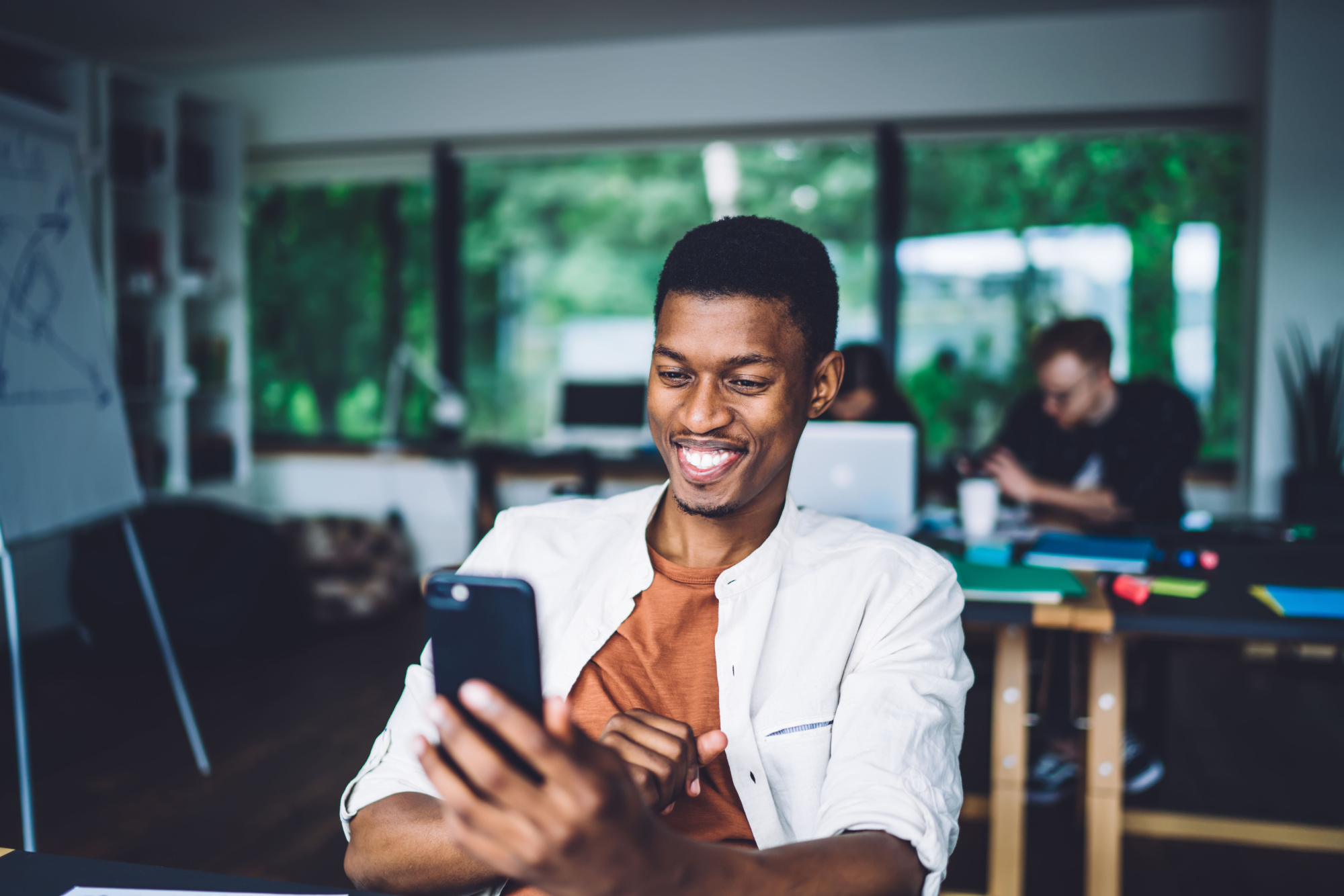 a man shops on his phone