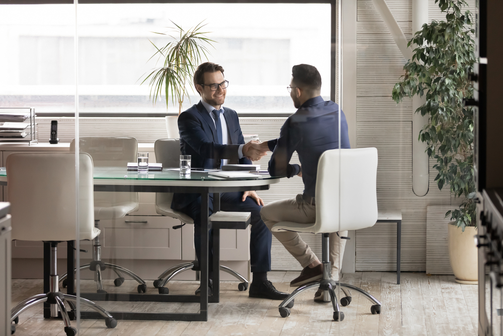 men talking in an office