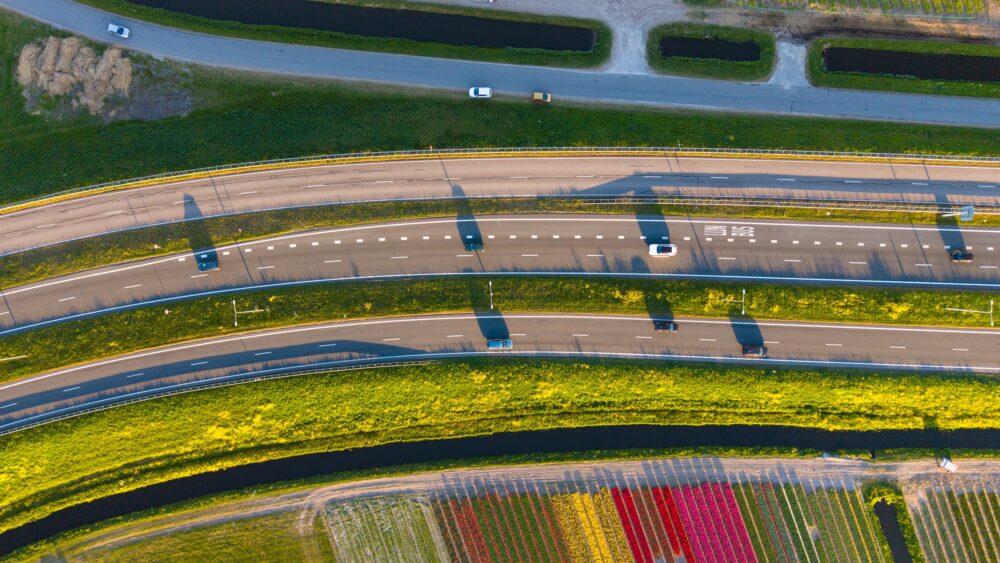 This is a drone photo of a highway through the countryside in the Netherlands