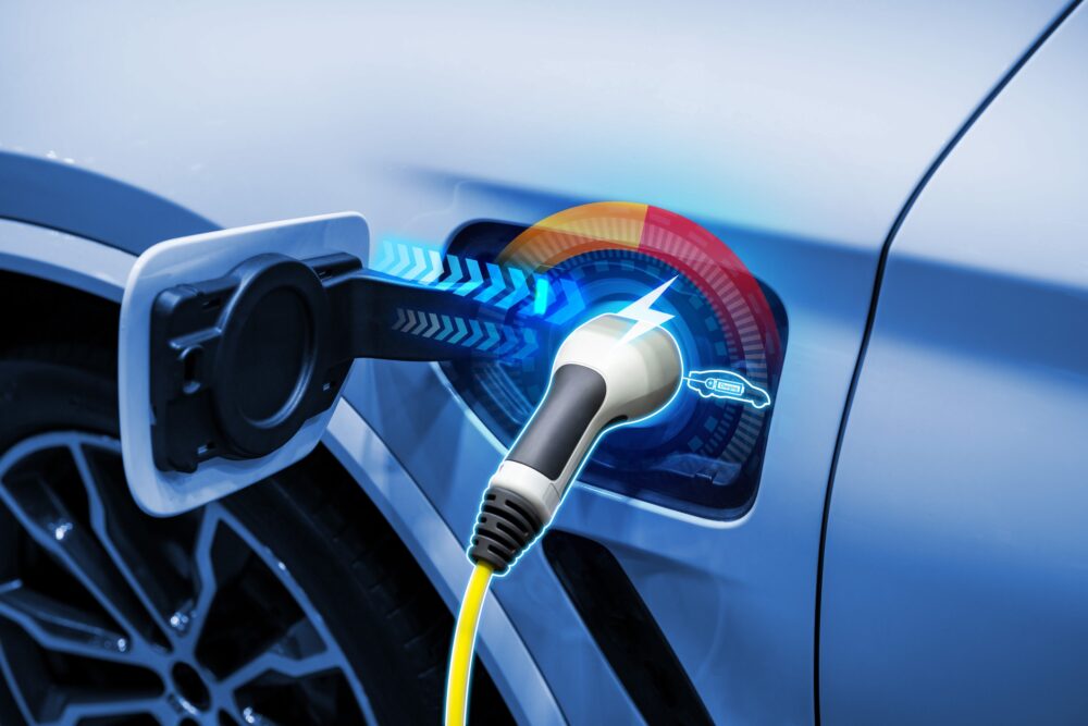 Power cable pump plug in charging power to electric vehicle EV car.||||||