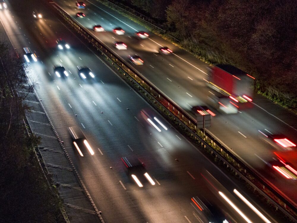 Cars on a road in France at night|