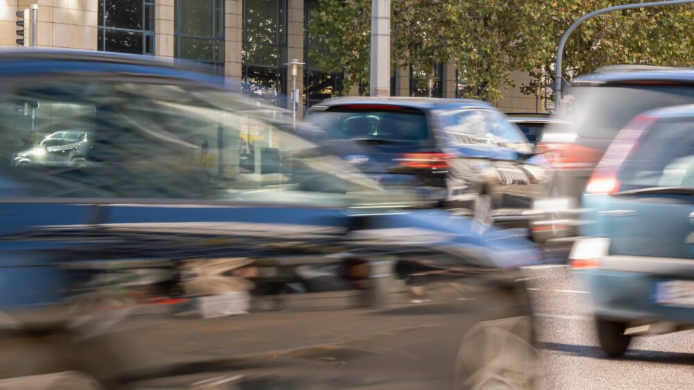 blurred driving cars outdoors on city street