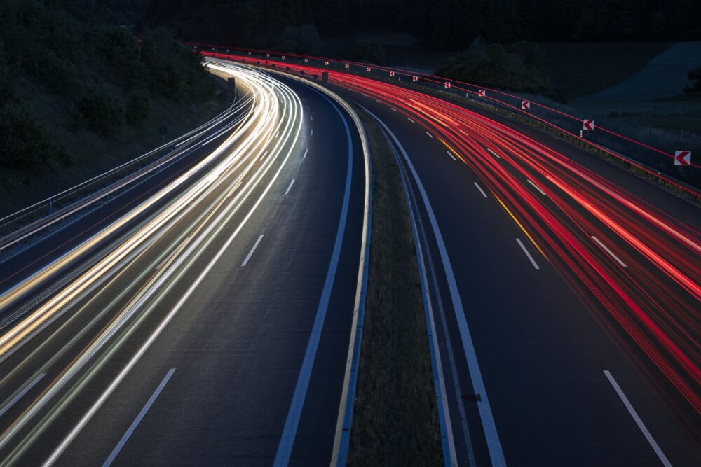 Car light trails on highway at night