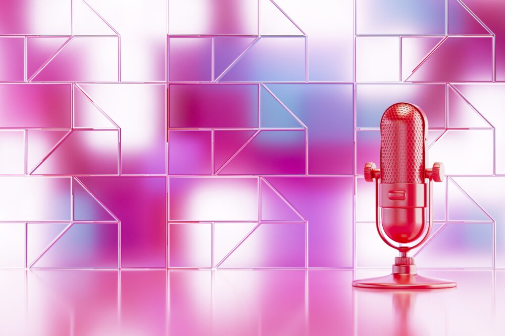 Microphone with Transparent Glass Panel in Front of Neon Lights|